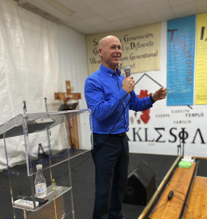 Pastor Emilio Sevilla speaking at church